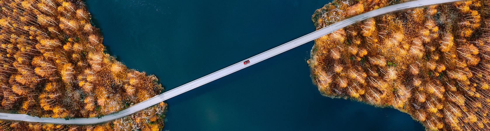 Ariel view of bridge with car driving over