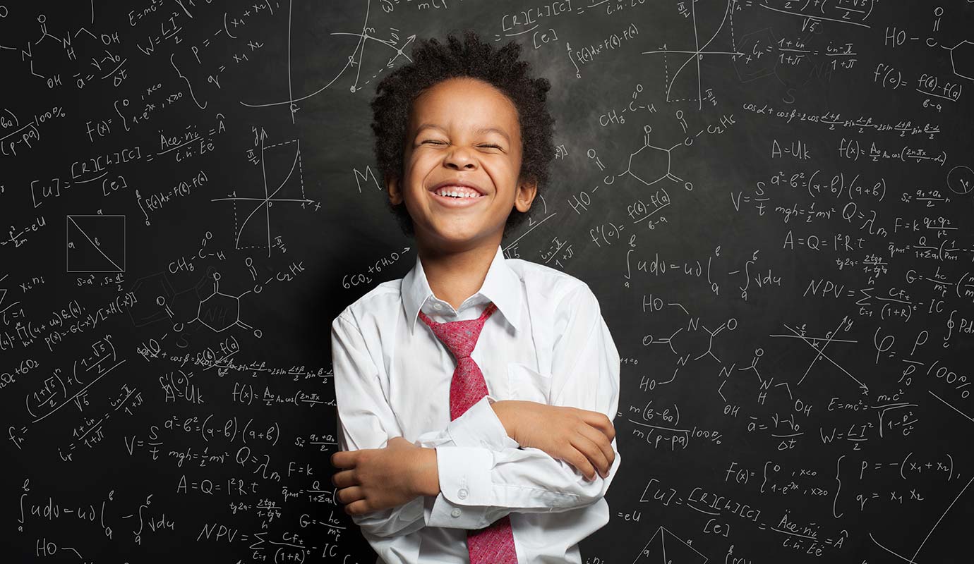 Child with tie smiling