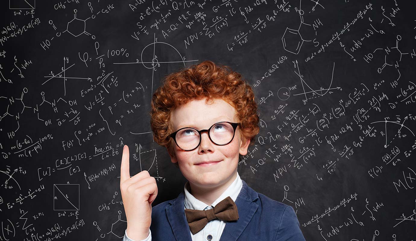 Young boy with suit and glasses