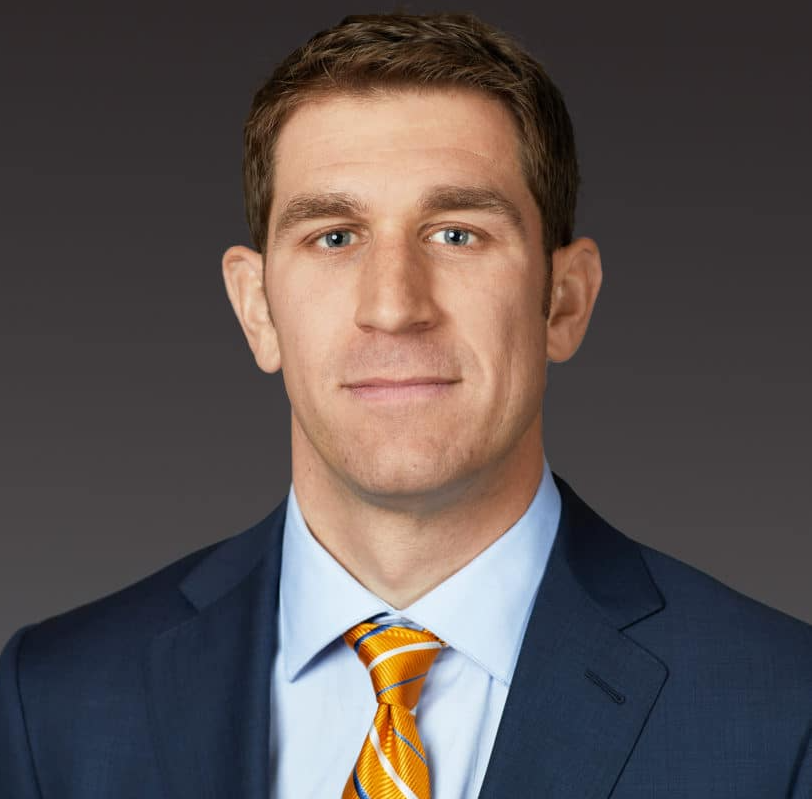 Man in a suit looking at the camera