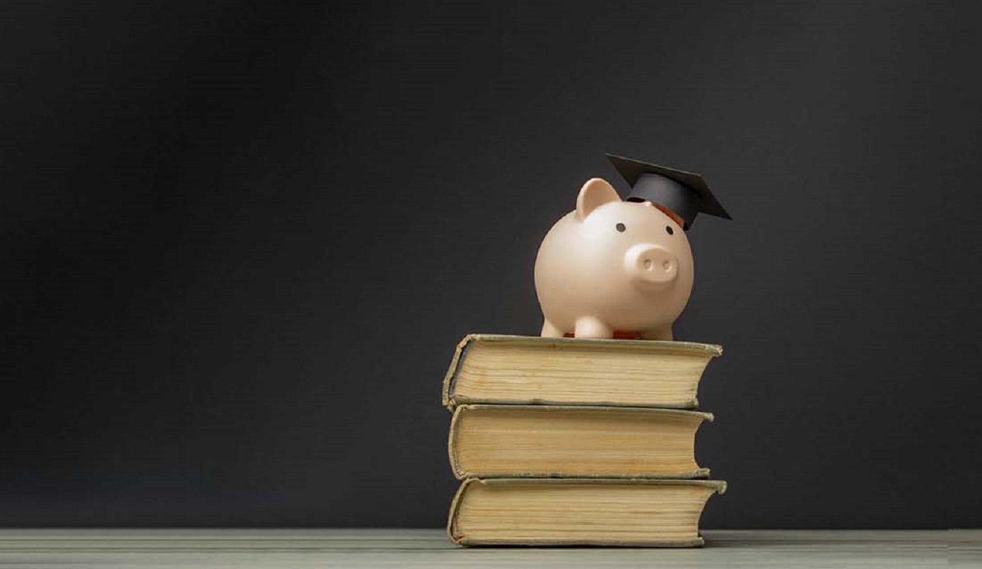 A piggy bank on a stack of books