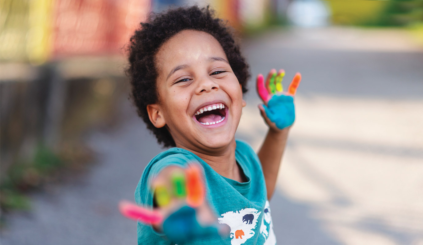Child with paint on their hands