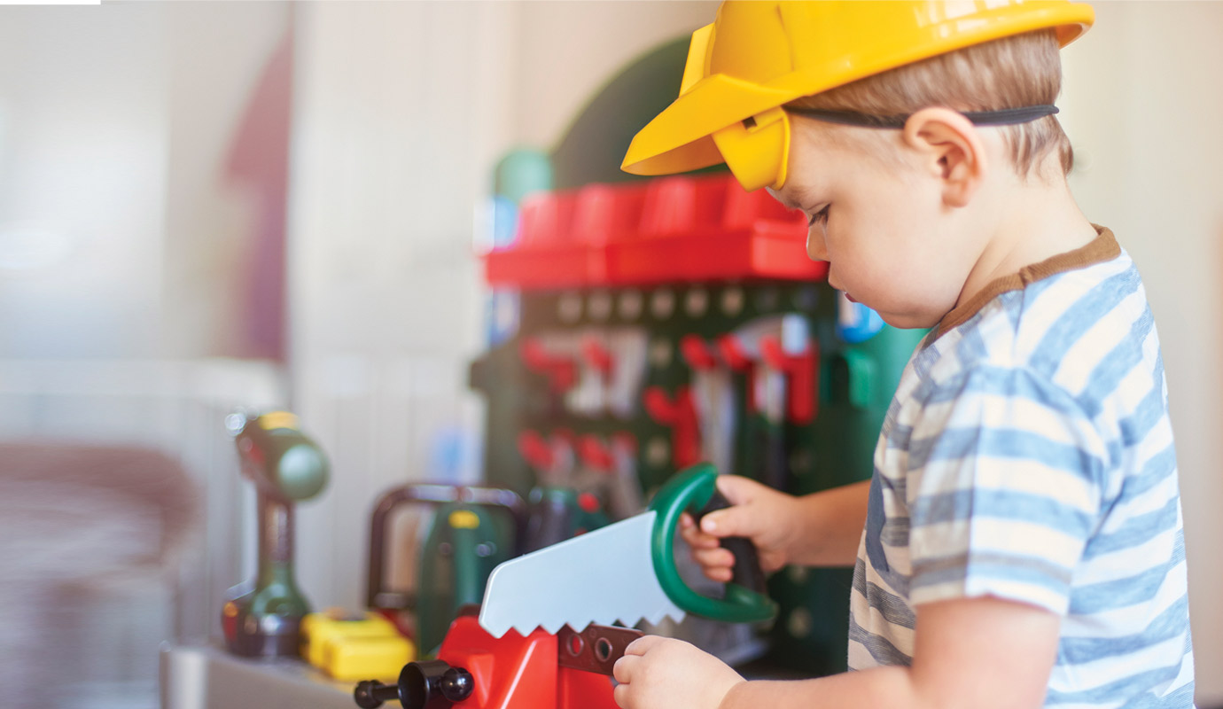 Child playing with a toy construction set