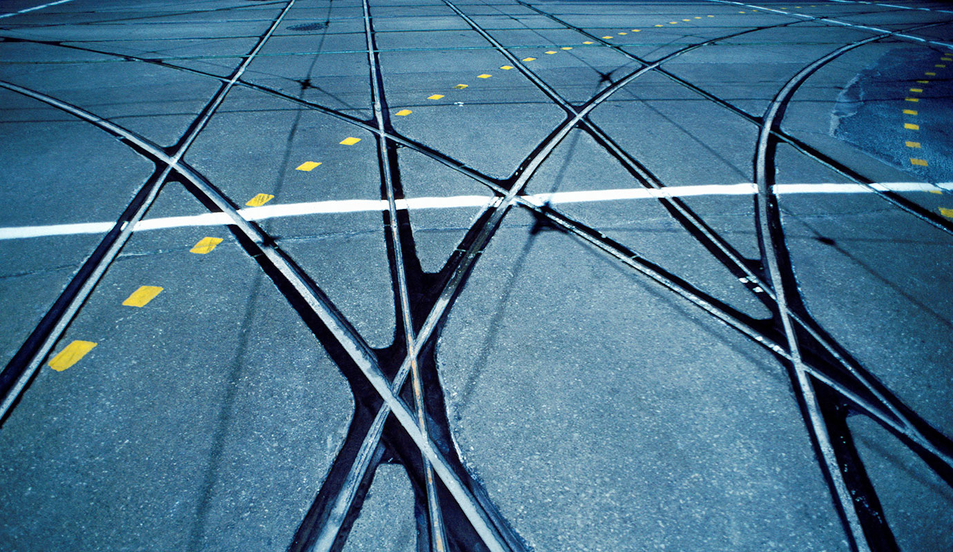 Criss-crossing lane outlines on pavement