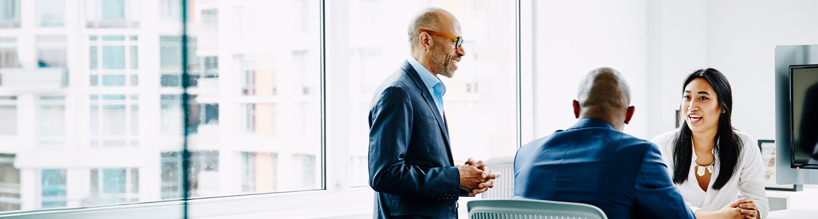 3 person talking in a office