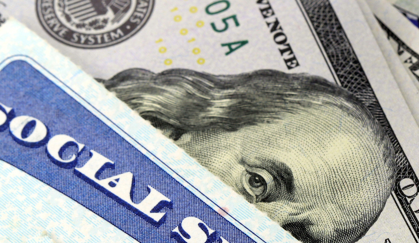 Social security card and hundred dollar bill