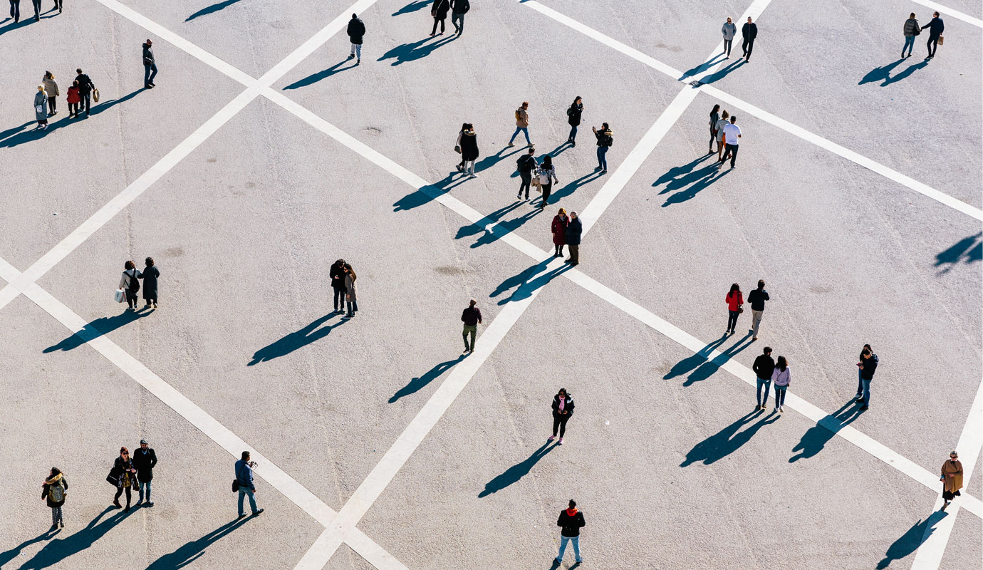 People scattered across the space walking and standing
