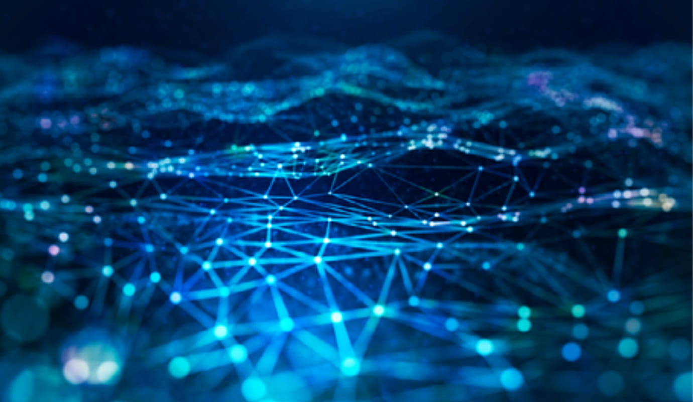 Graphic of an illuminated network over a varied black terrain